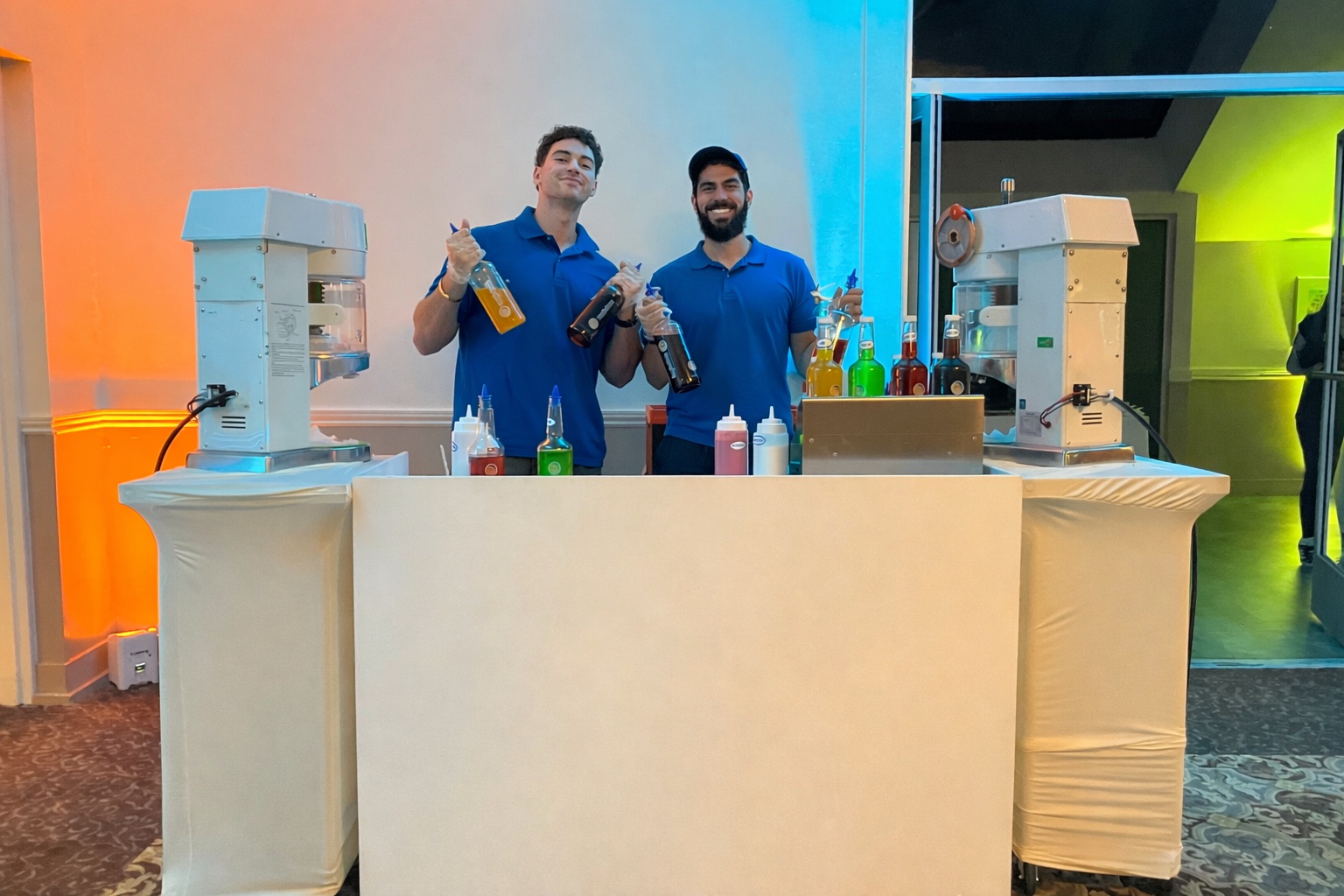 Marina Ice Co. staff serving premium shave ice to customer at outdoor event